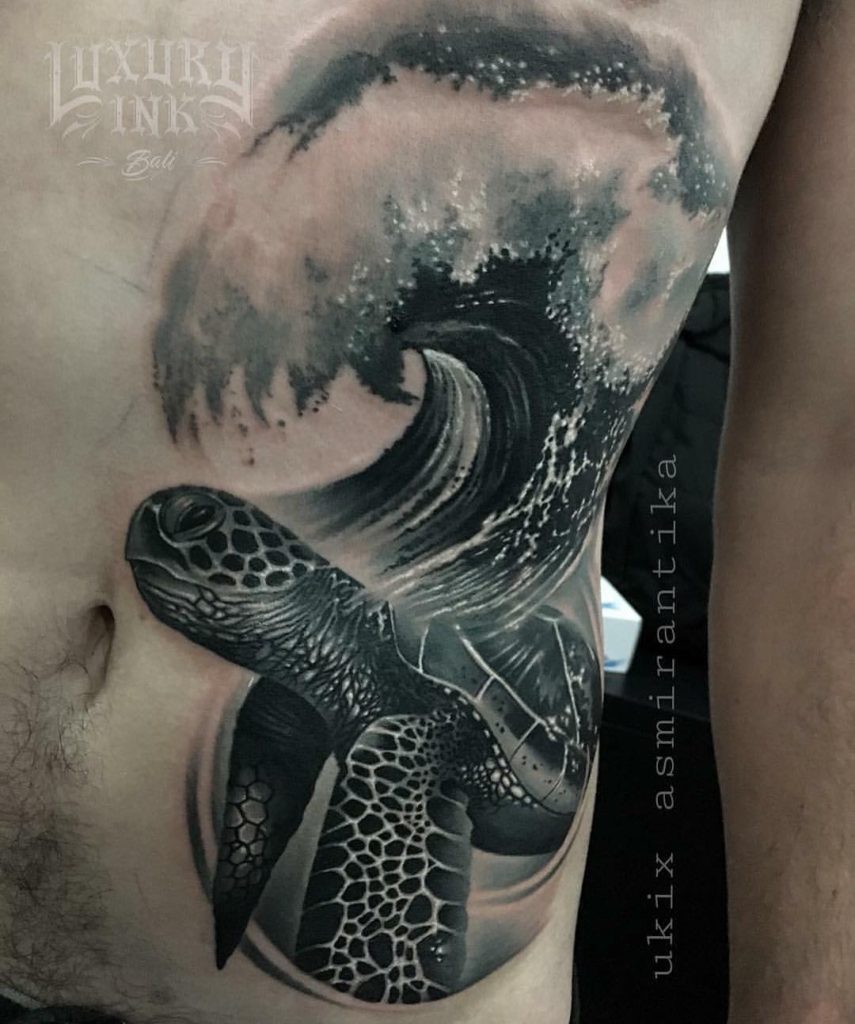 Black and grey ocean wave tattoo by Ukix