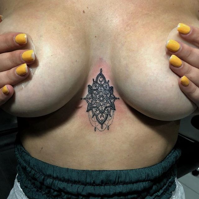 Bali tattoo tiny mandala between breasts by ucenkartattoo at Tattoo Hut March 2018