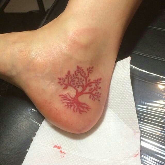 only red tattoo on heel of foot