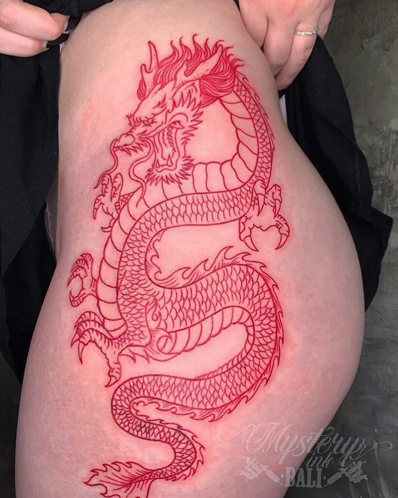 Epic dragon red ink linework thigh tattoo by Mystery Ink Bali Dec 2019