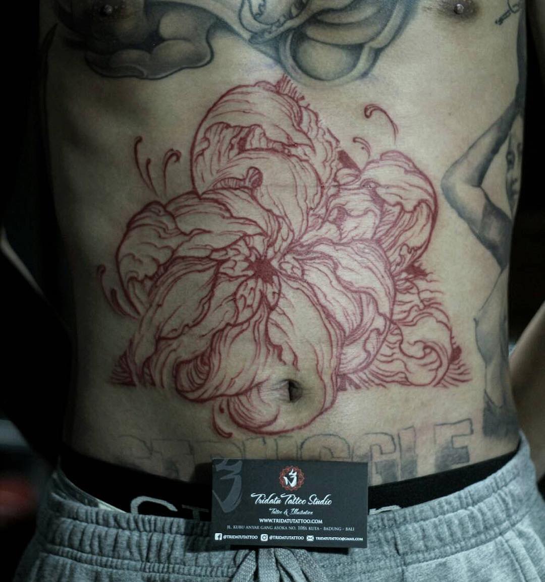 red flower tattoo stomach linework