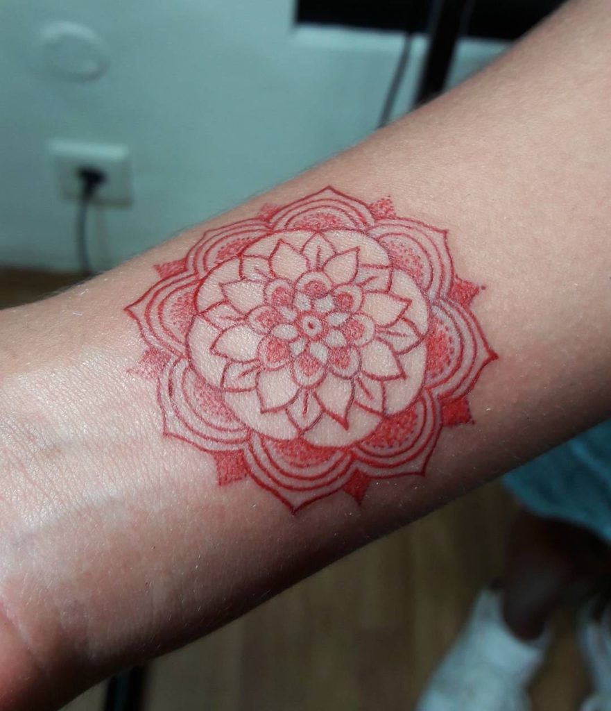 Red mandala tattoo by Indra Nice Art Tattoo