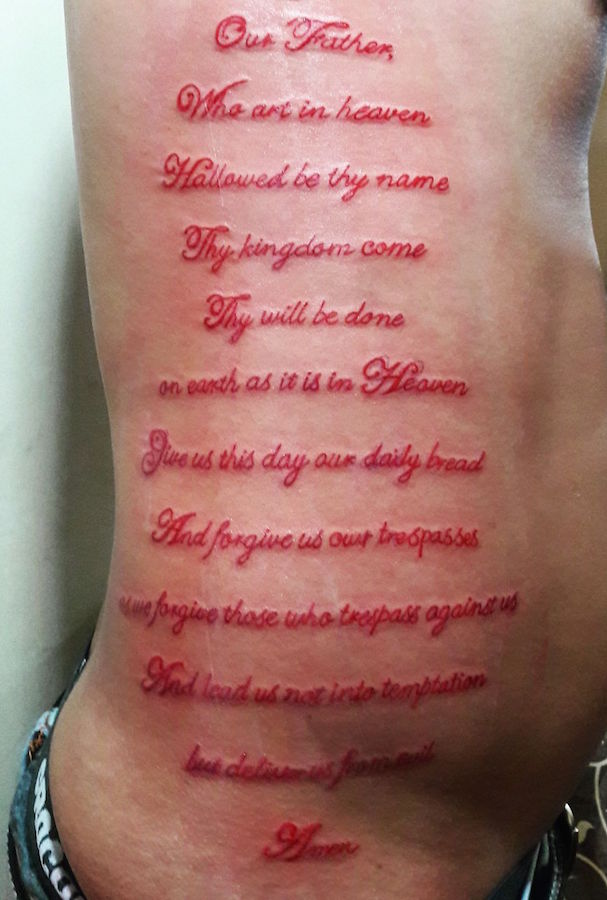 the lords prayer tattoo red lettering