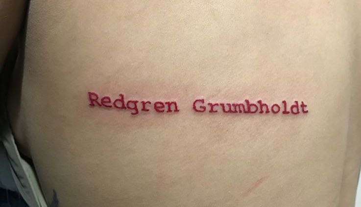 red ink typewriter tattoo