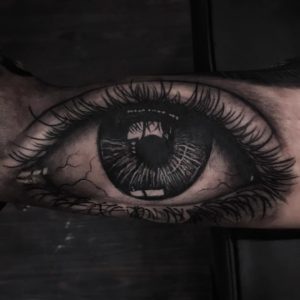 Black and grey eye tattoo by Turah Ink - Notorious Ink Bali