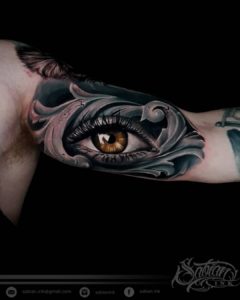 Brown eye tattoo by Sabian Ink artist Dena Rio