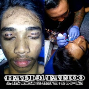 Eyelid tattoos God Bless lettering posted by Hadi31