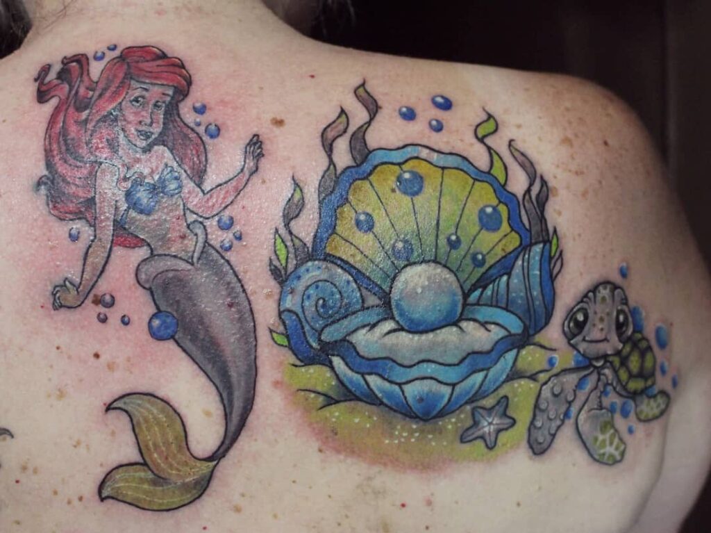 Ariel The Little Mermaid tattoo, pearl and Crush Finding Nemo turtle tattoo by TuAde for Sideline Tattoo Studio Ubud Bali