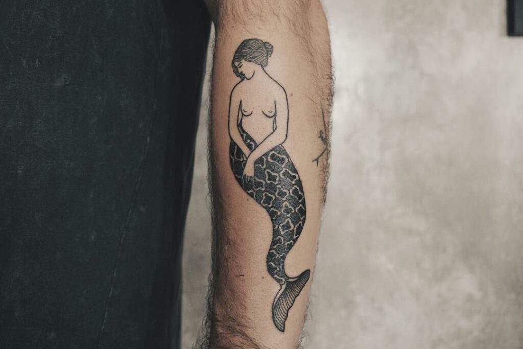 Topless mermaid tattoo with batik tail by Foad Due Hatue Canggu