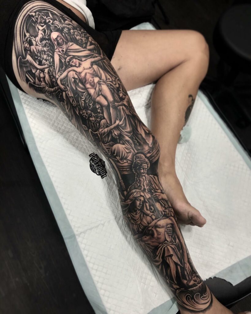 Romanticism realistic religious figures black n grey full leg sleeve tattoo Platinum Tattoo Studio Bali Nov 2019