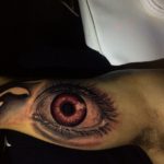 Brown eye tattoo by Andri for Diamond Dog Tattoo Shop