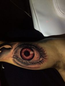 Brown eye tattoo by Andri for Diamond Dog Tattoo Shop