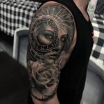 Tattoo portrait on upper arm