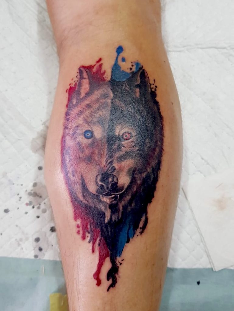 Watercolor tattoo wolf by artist Tude Gumer